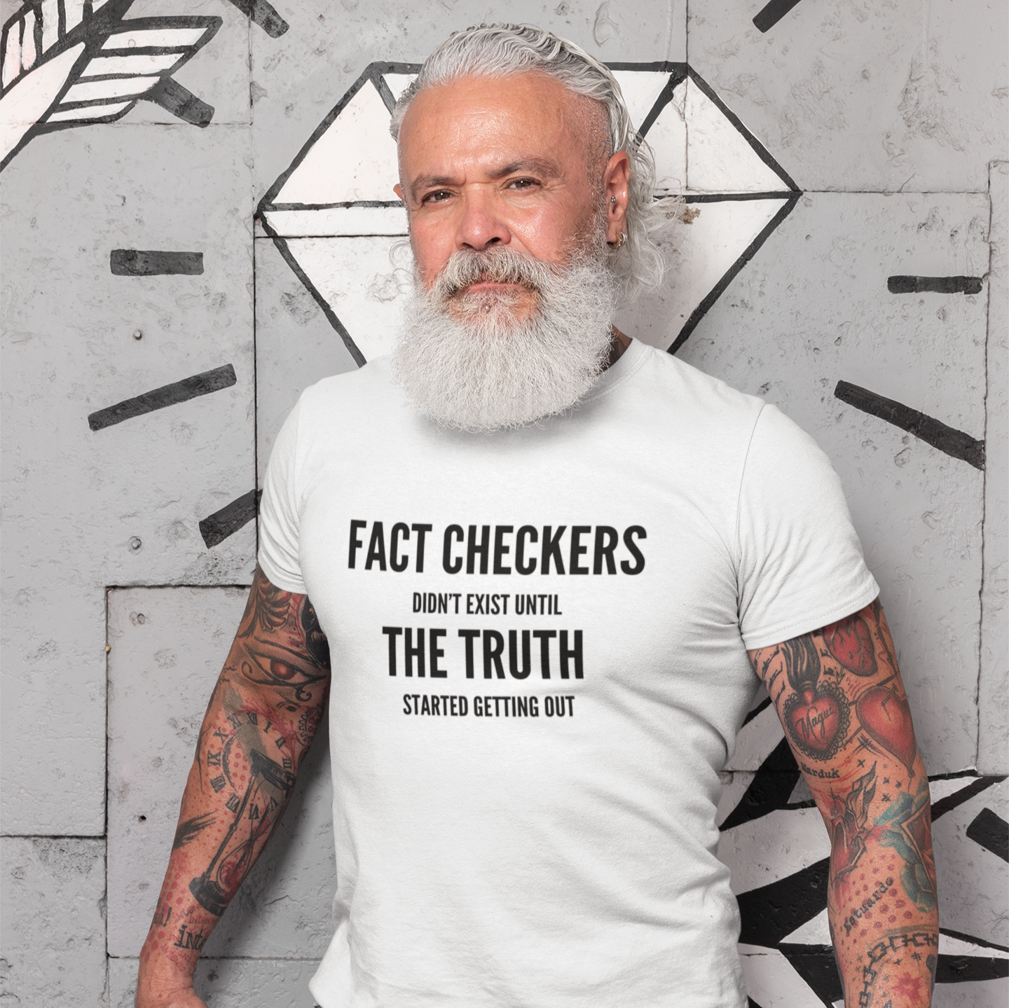 man wearing a white fact checker election t-shirt