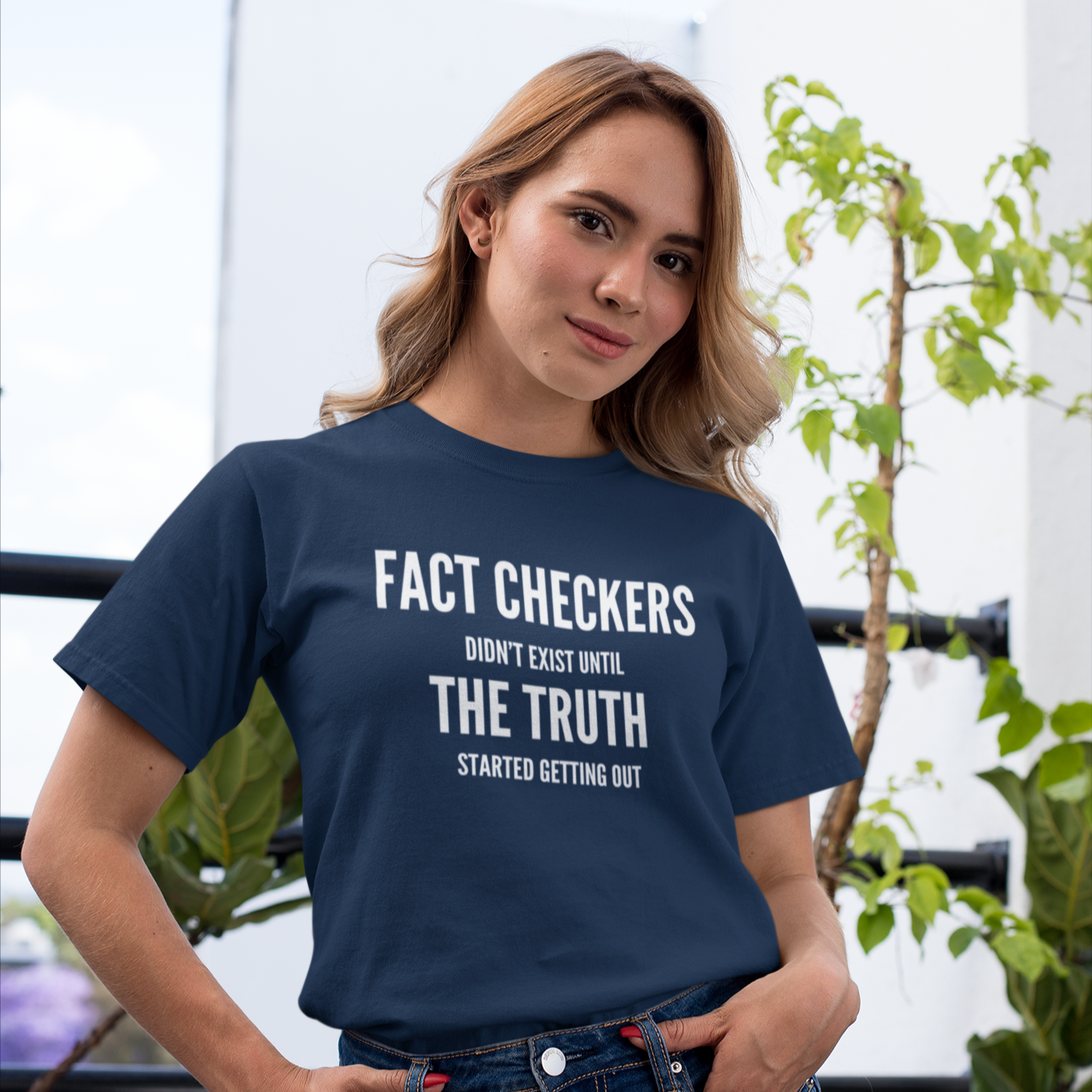 woman wearing a navy blue fact checker election t-shirt