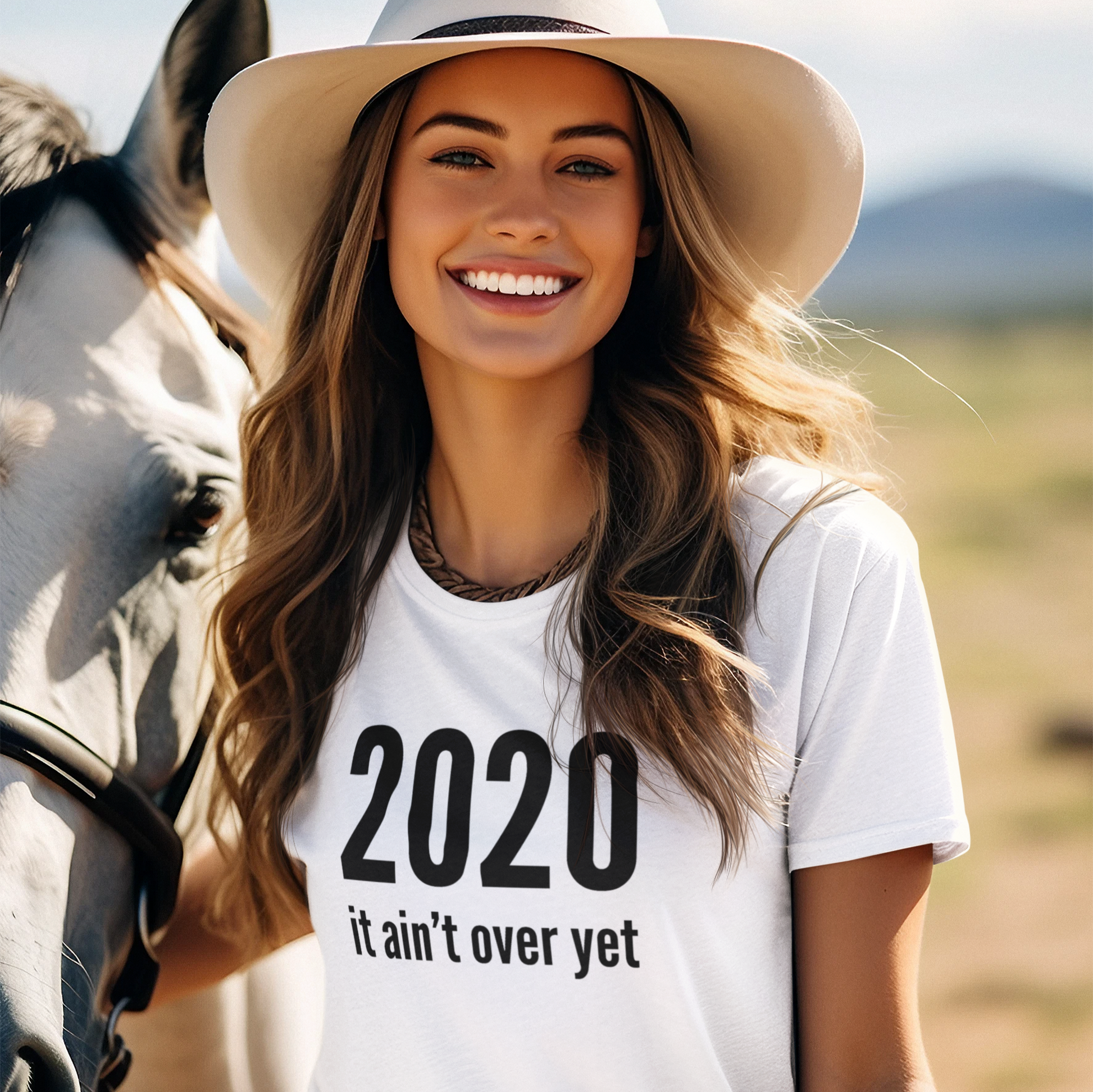 woman in cowboy hat wearing a white election t-shirt